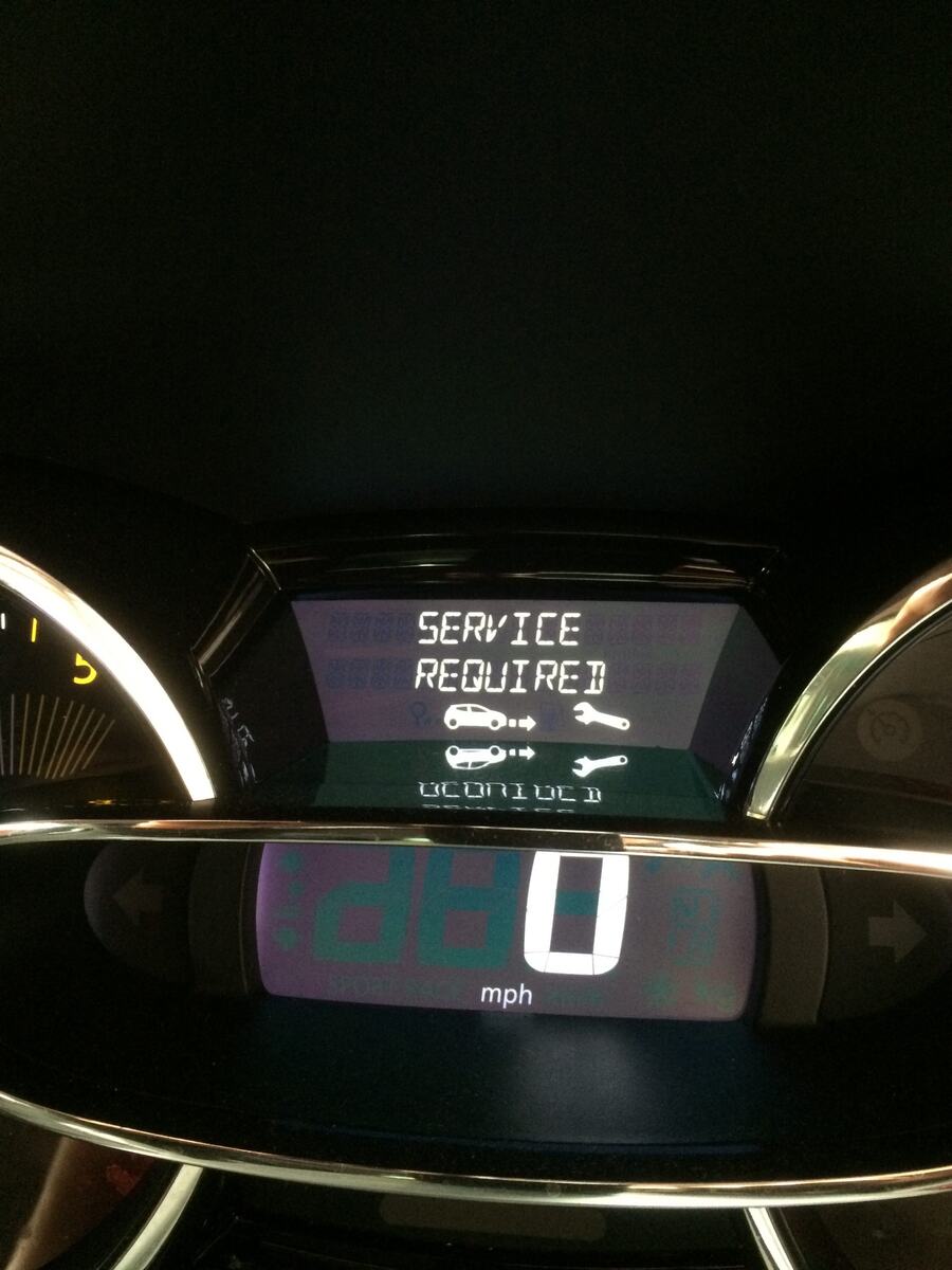 Renault dashboard with a service required message